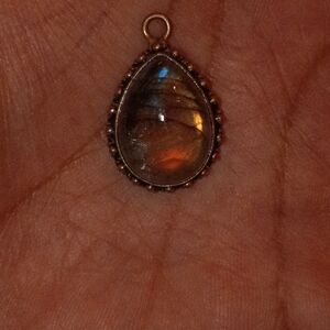 stunning sterling silver pendant features a teardrop-shaped labradorite gemstone